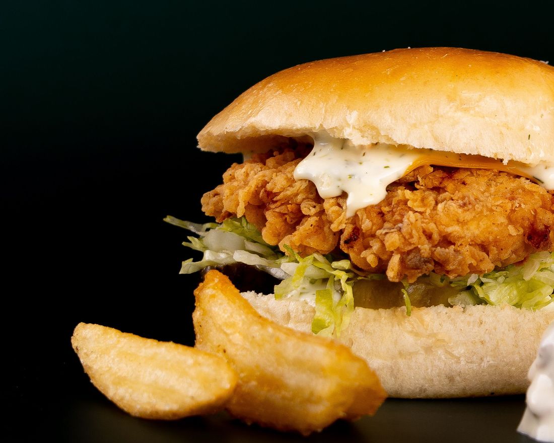 Crispy chicken burger with wedges